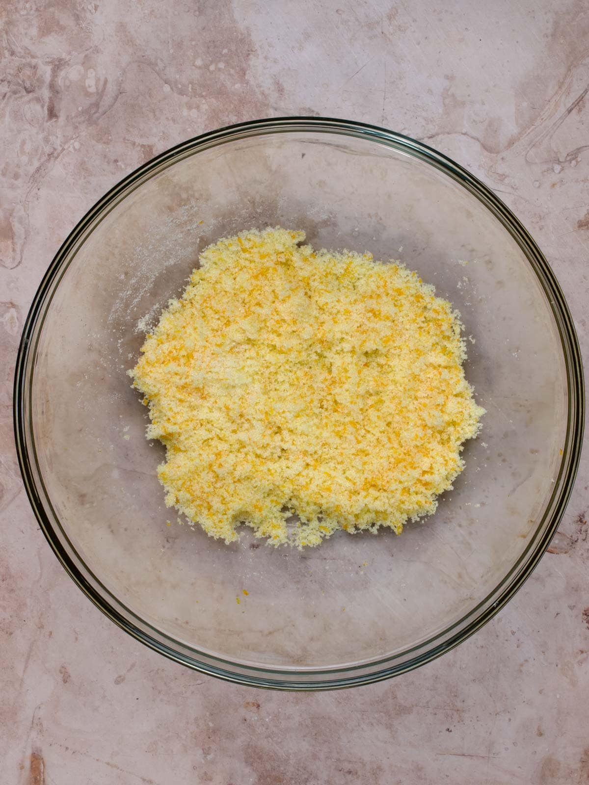 granulated sugar with orange zest in a glass bowl