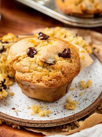 orange chocolate chip muffin on a plate