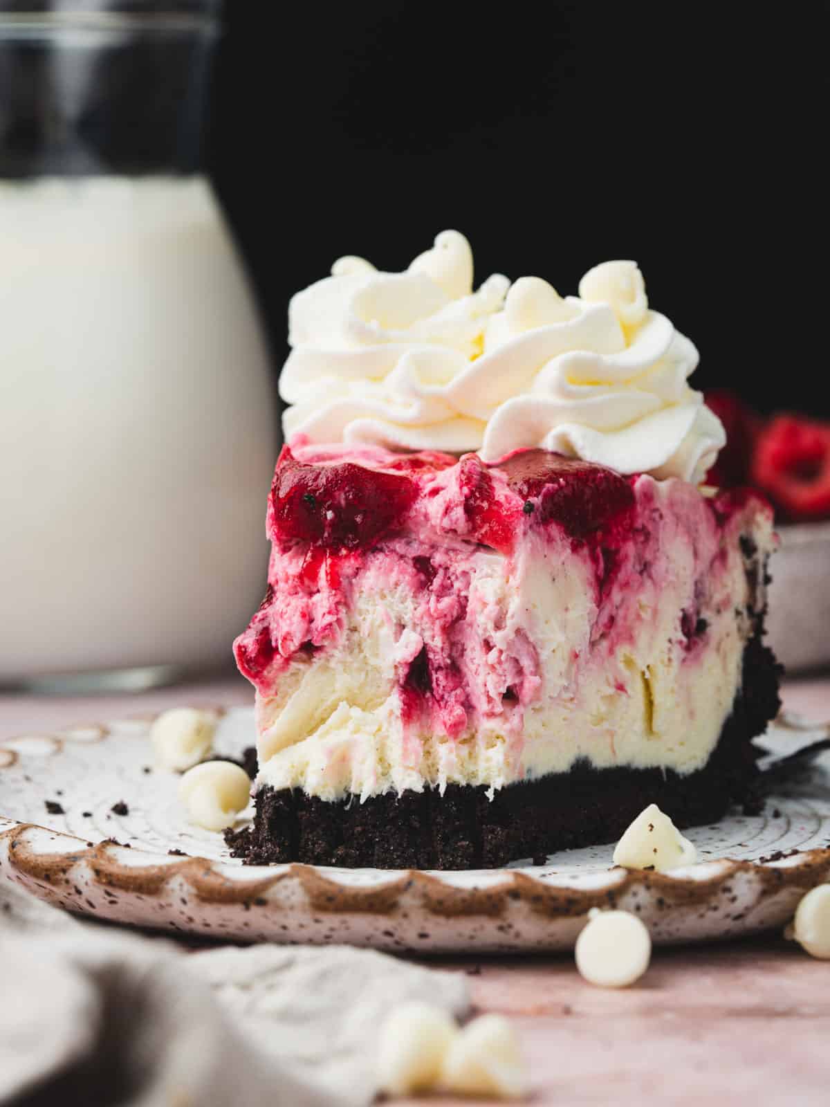 no bake white chocolate cranberry raspberry cheesecake on a plate