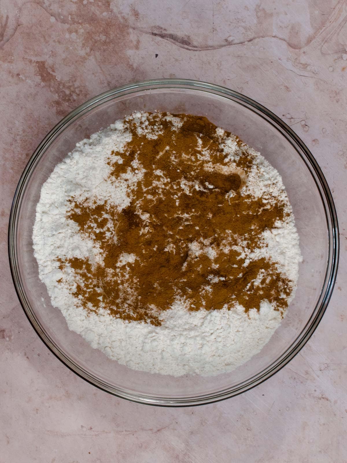 flour, baking soda, and spices in a glass bowl