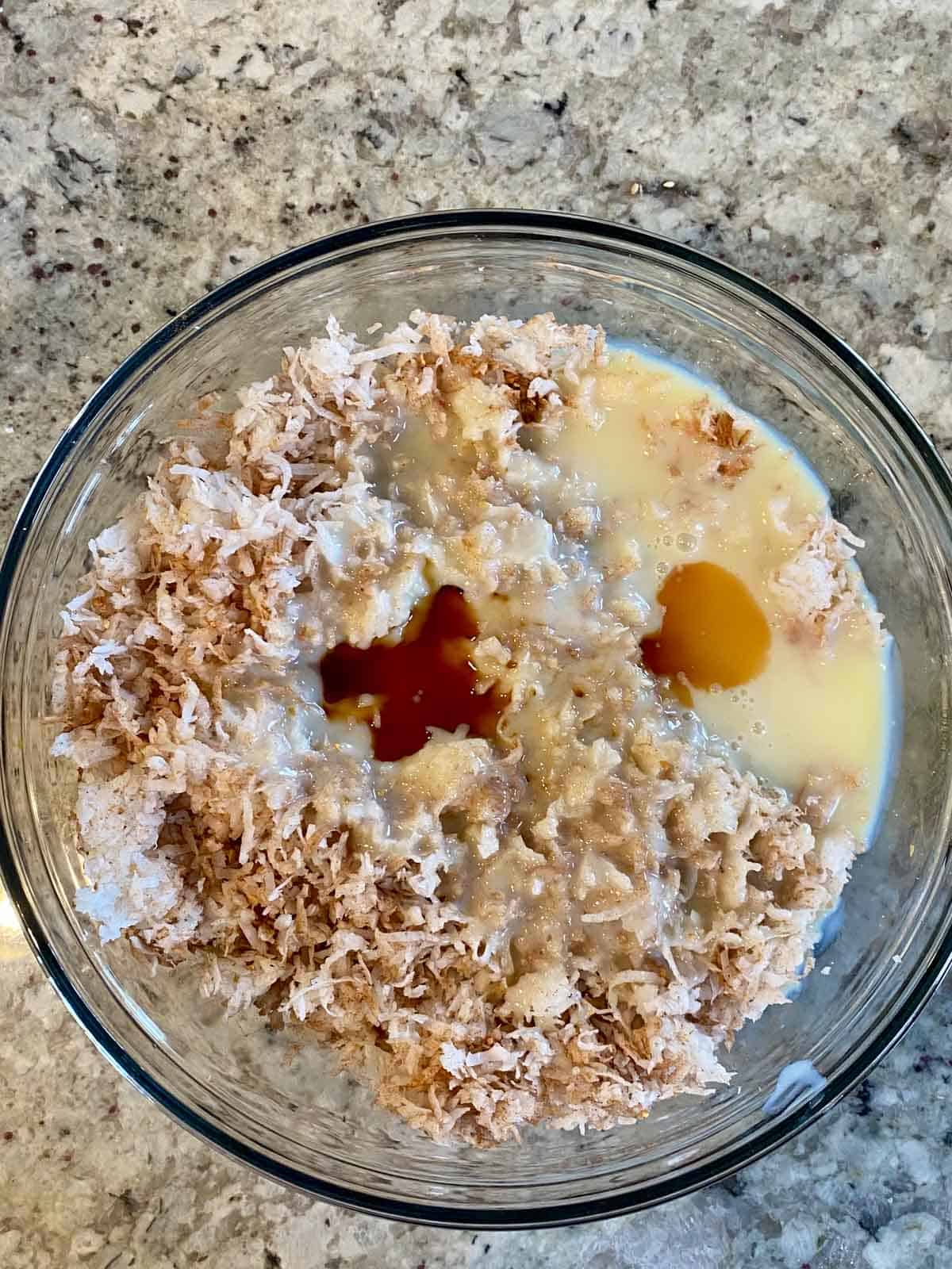 coconut sweetened condensed milk cinnamon orange peel vanilla extract in a glass bowl