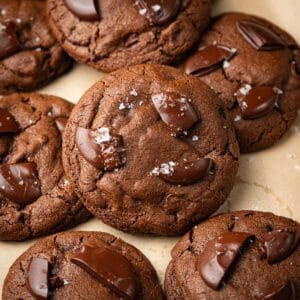 Espresso chocolate chip cookies on a cookie sheet with parchment.