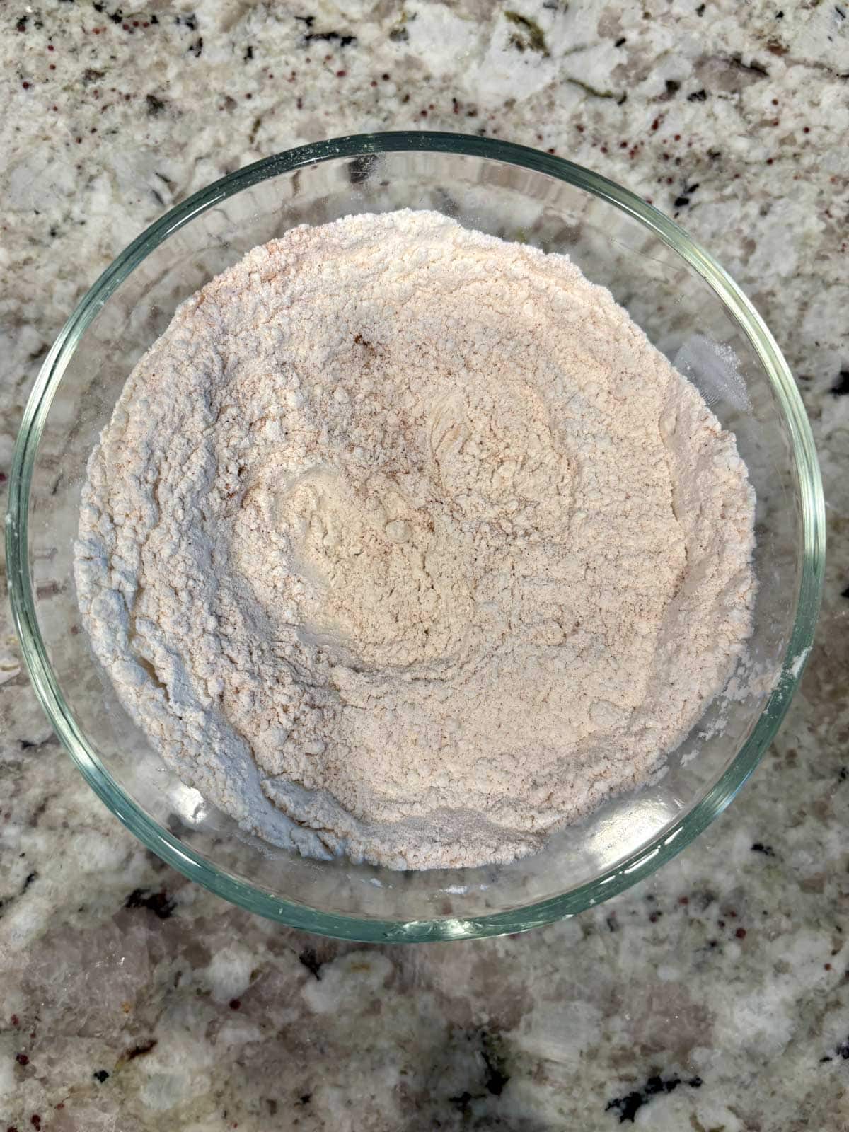 The dry ingredients mixed together in a bowl on the counter.