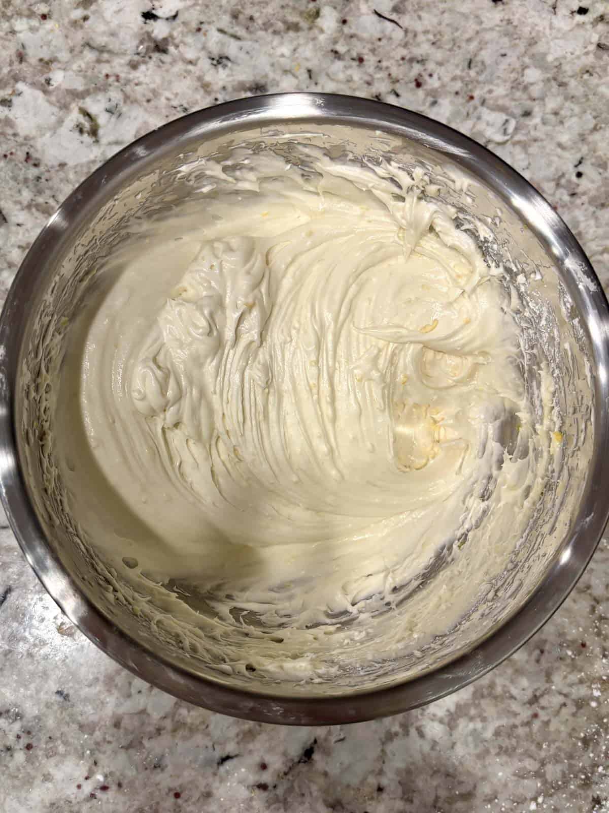 Powdered sugar added to the butter cream cheese lemon mixture.