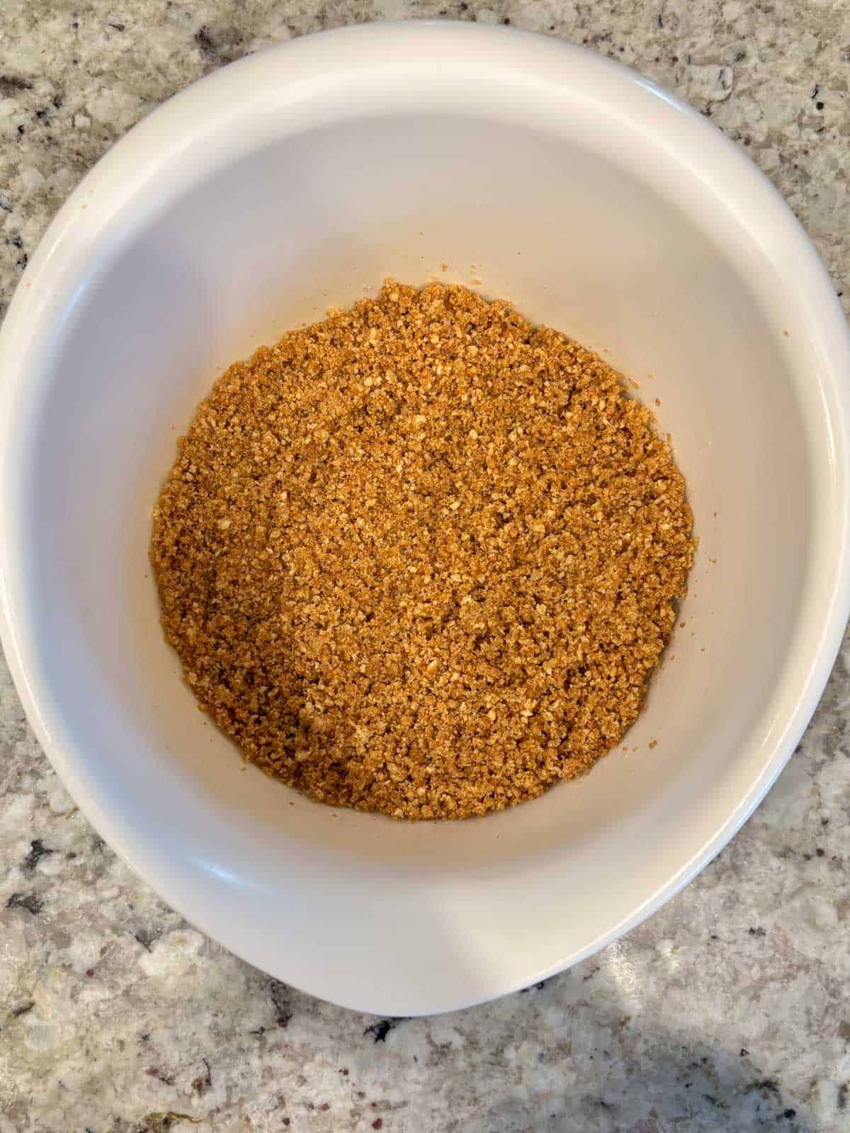 Crushed up with graham cracker crumbs with sugar and cinnamon in a bowl.
