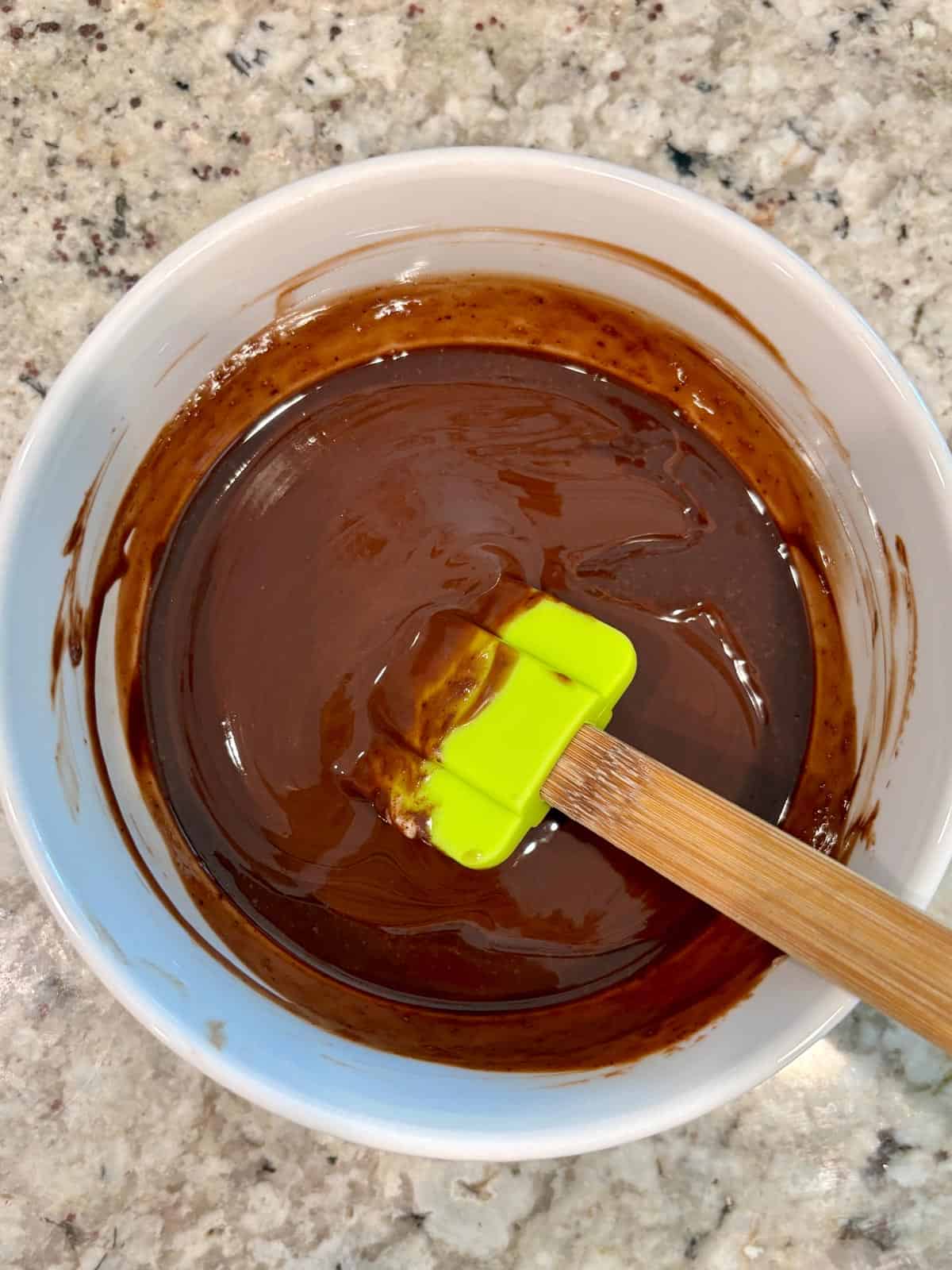 Butter, chocolate, and espresso powder melted in a bowl.