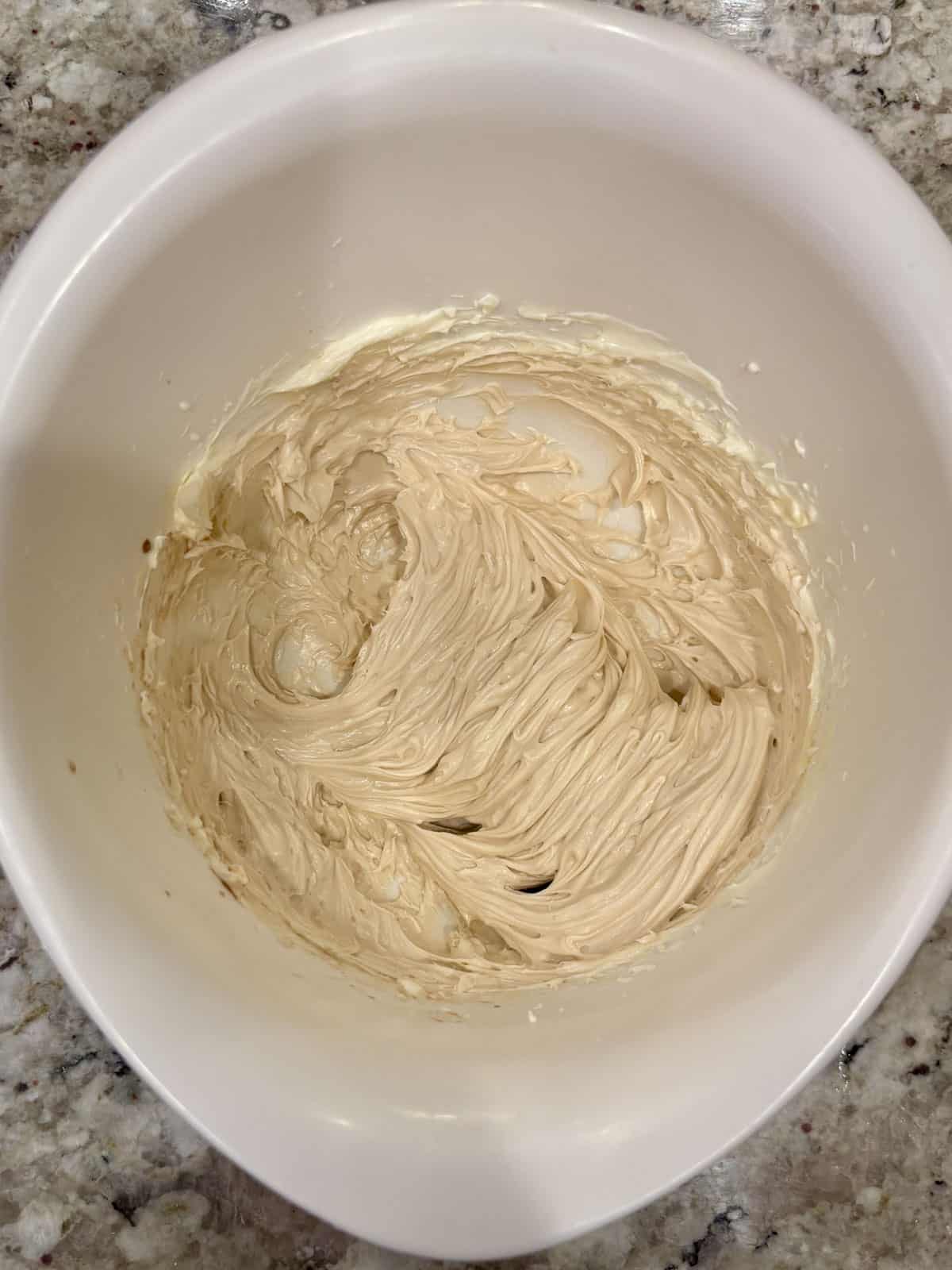 Cream cheese, butter, and vanilla in a bowl mixed until smooth.