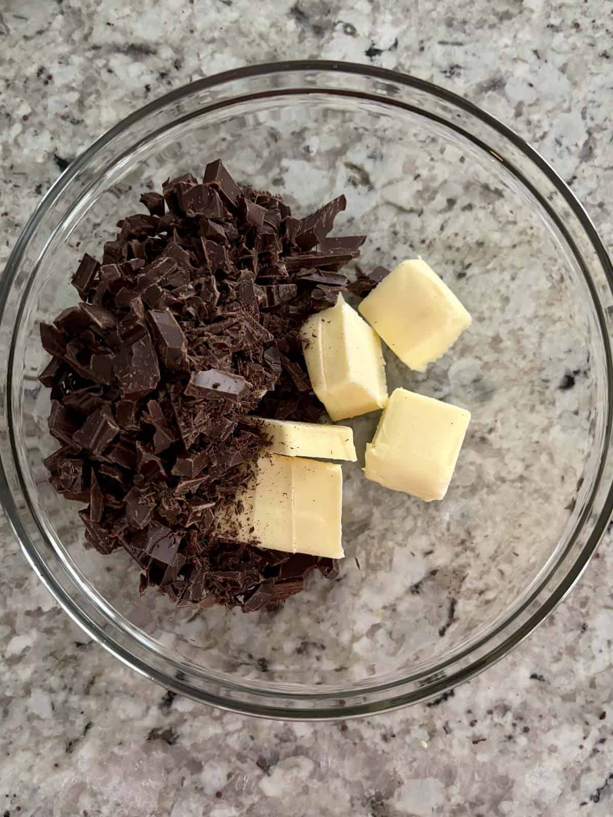 Cut up butter and chopped chocolate in a glass bowl.