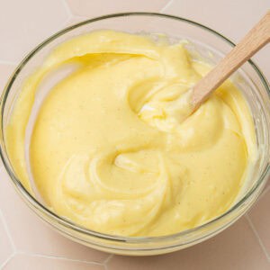 Showing the pastry cream in a glass bowl on the counter.