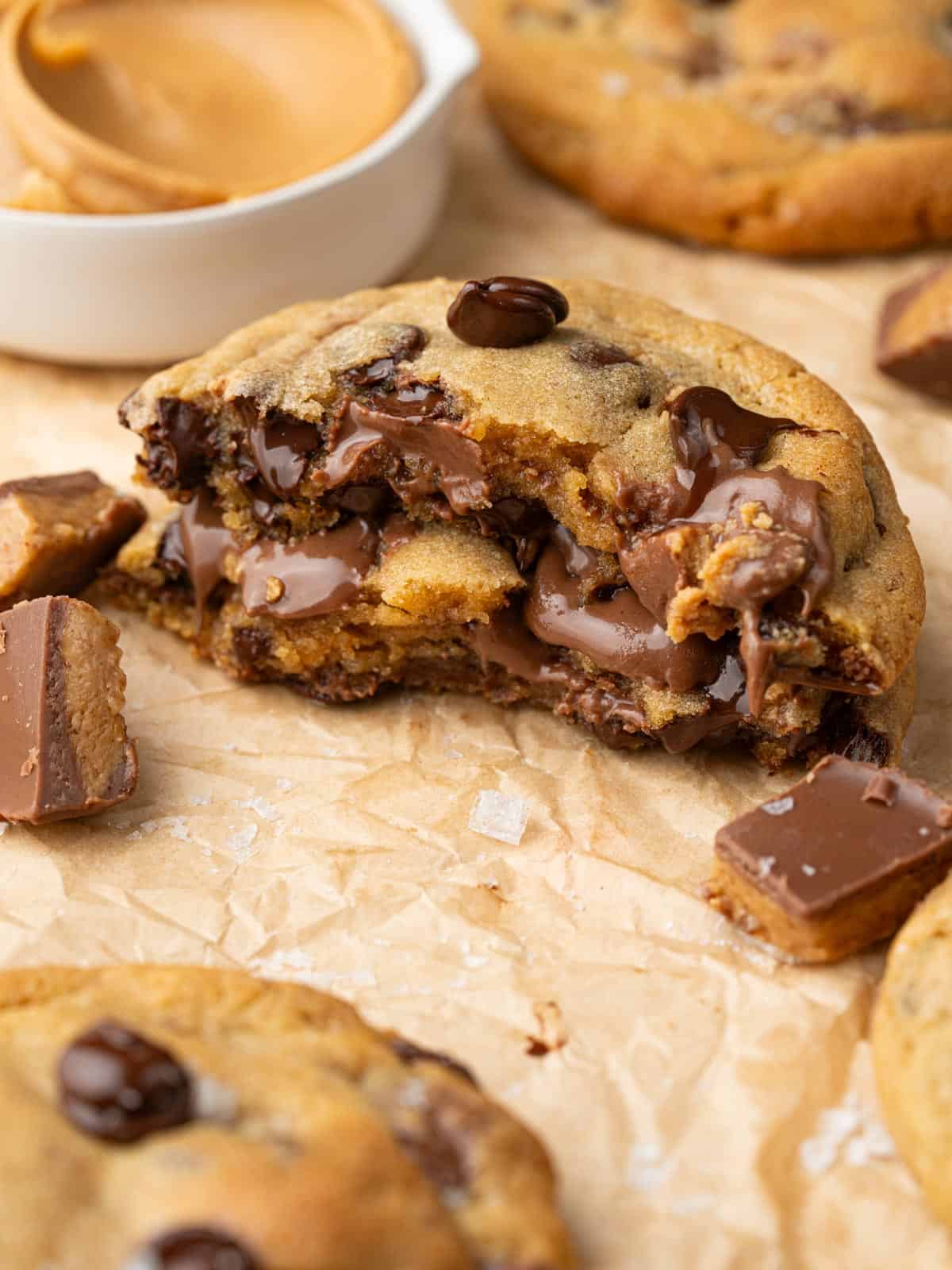 Showing the melted chocolate in the middle of the cookies on parchment.