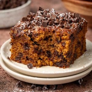 Pumpkin cake with mini chocolate chips on top and around.