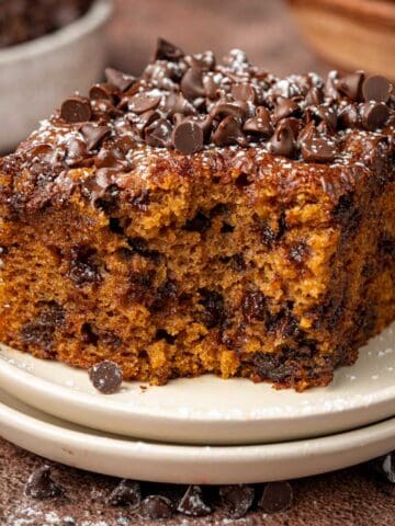 Pumpkin cake with mini chocolate chips on top and around.
