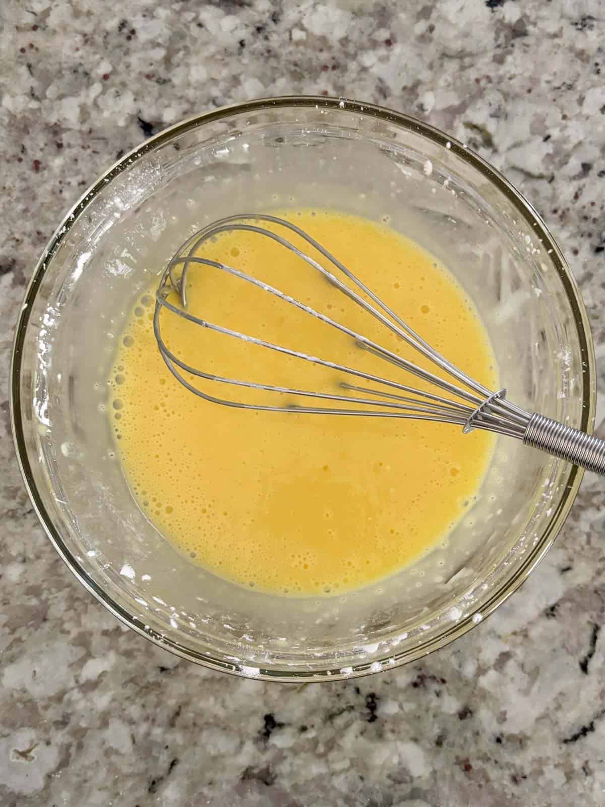 Egg yolks, cornstarch, and sugar in a bowl whisked until combined.