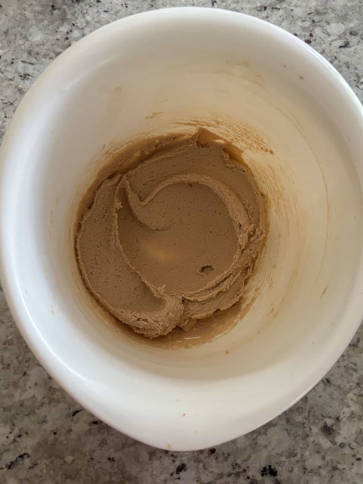 Brown sugar, butter, and granulated sugar in a bowl mixed together.
