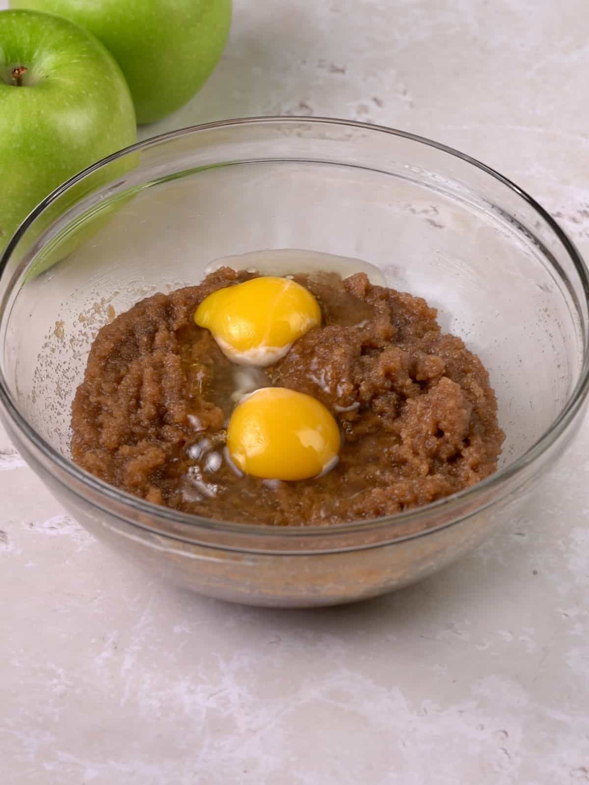 Egg, egg yolk, and vanilla being added to the brown butter mixture.