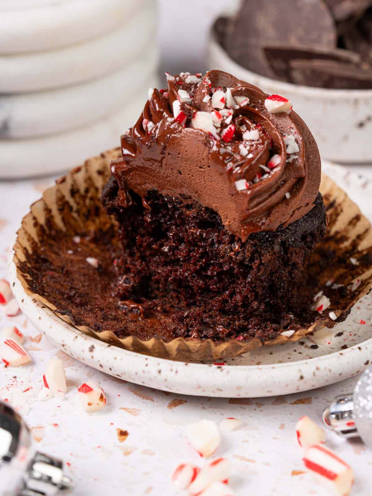 A chocolate cake with a bite taken out to show the texture.