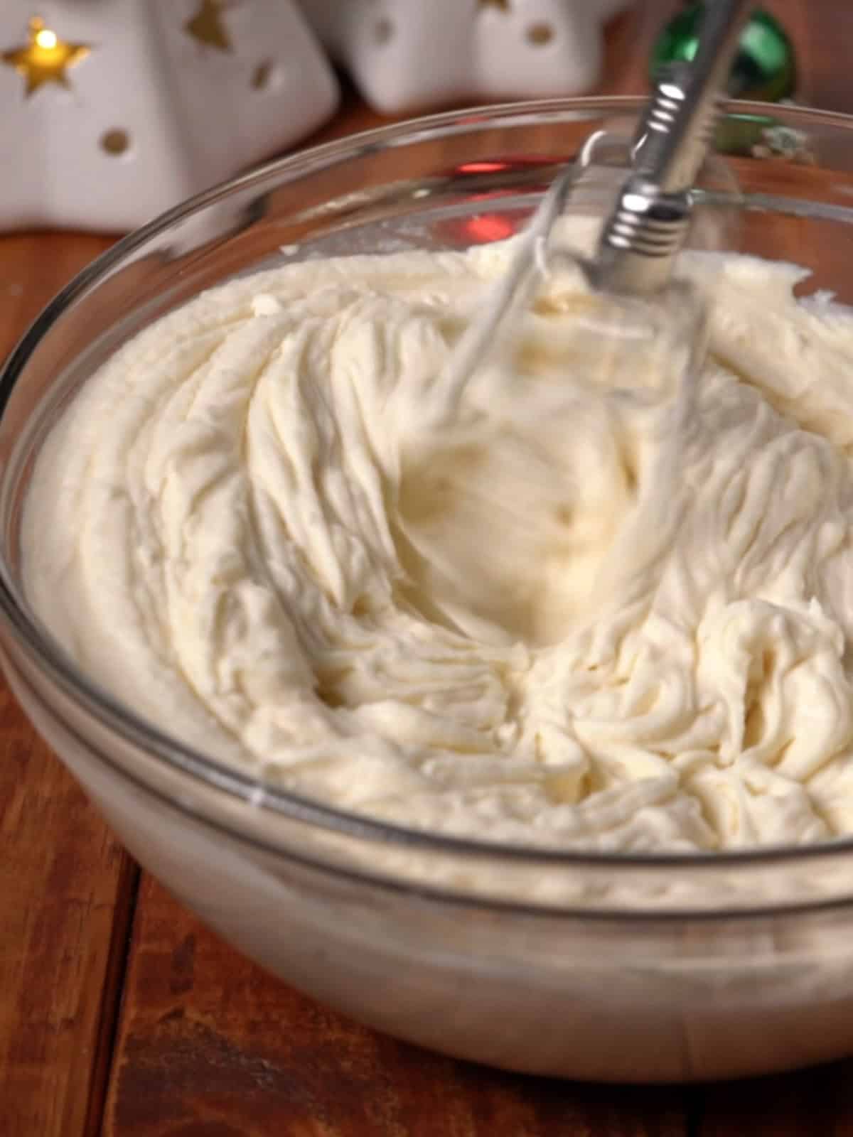 Mascarpone frosting being beat until light and fluffy.