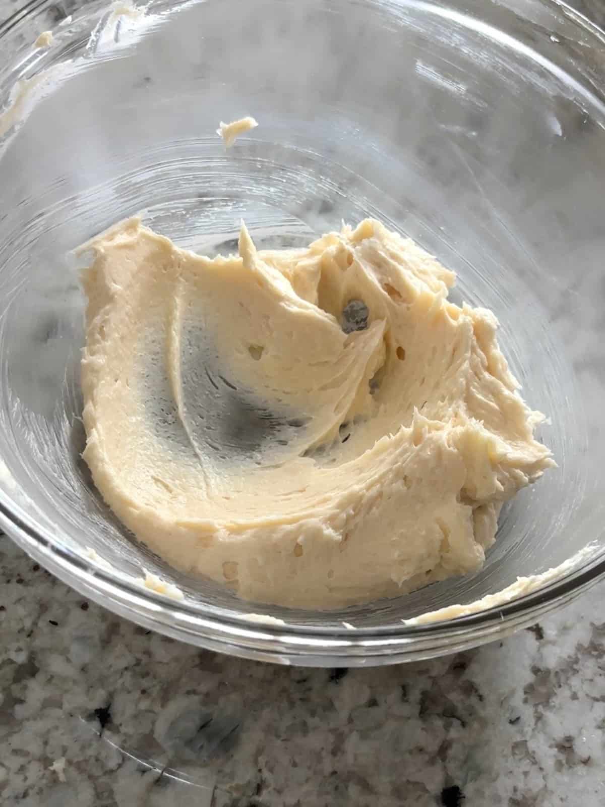The butter and sugar being creamed together with the extracts.