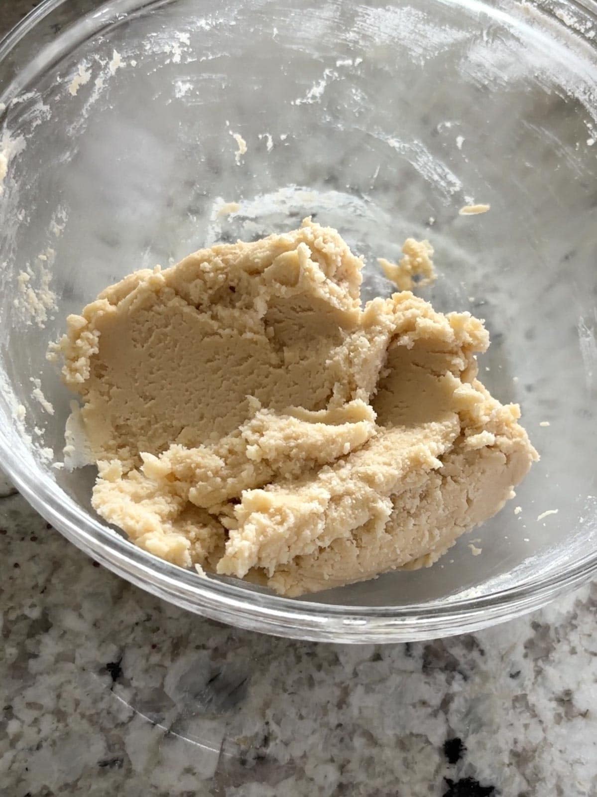 Shortbread cookie dough in a bowl ready to be rolled.