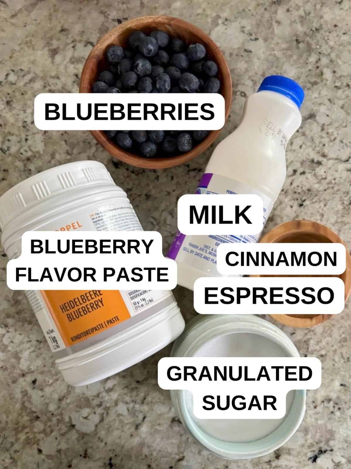 Ingredients on the counter labeled for the iced blueberry coffee recipe.