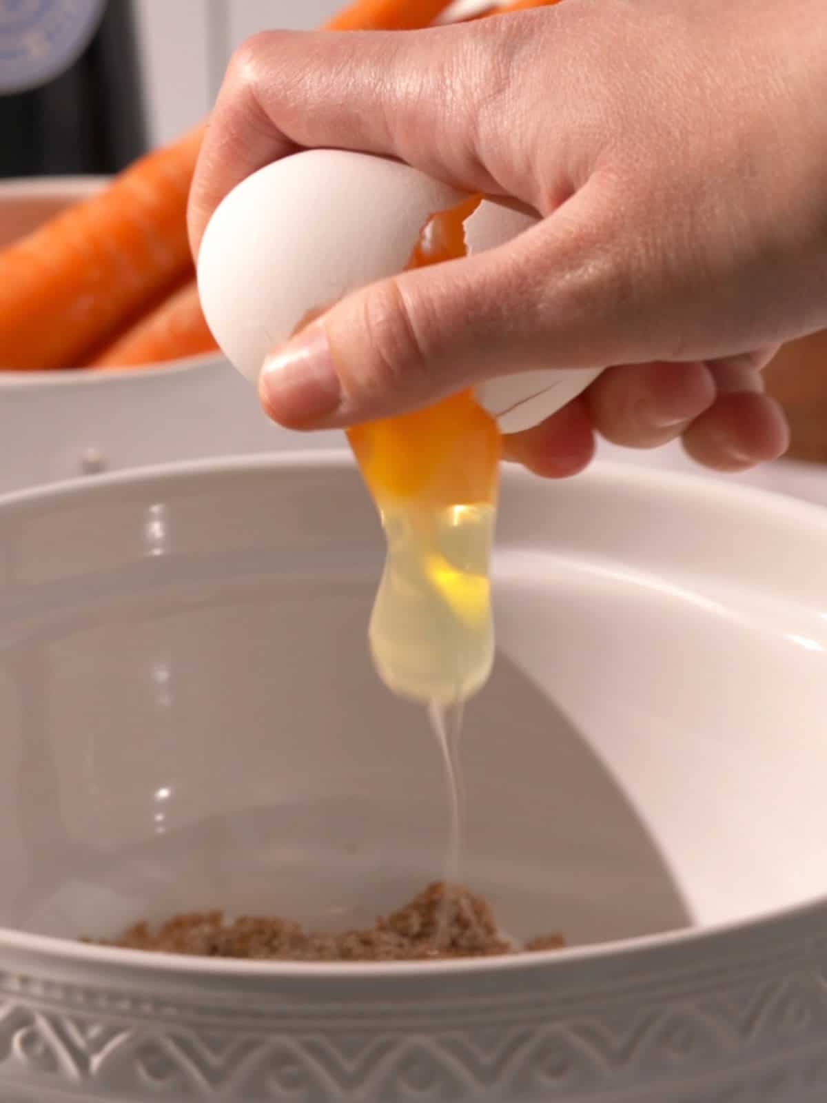 The brown sugar, eggs, oil, sour cream, and vanilla in a bowl being combined.
