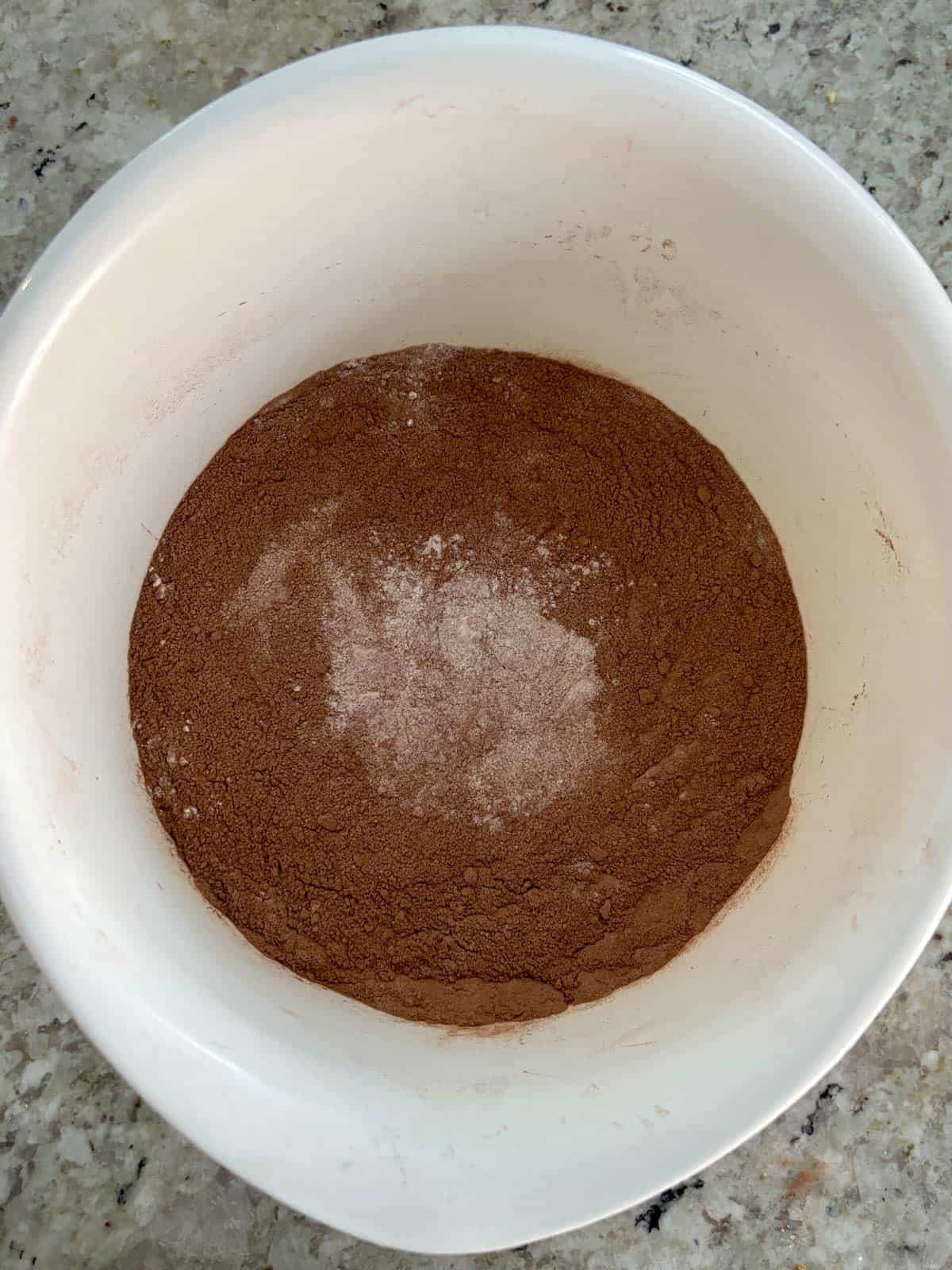 Cocoa powder, all purpose flour, baking soda, baking powder, sugar, and salt in the bowl.