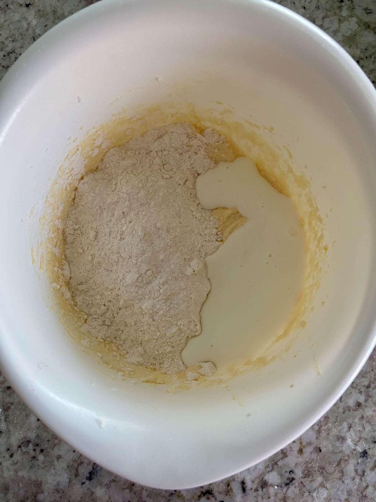 Adding the dry ingredients and buttermilk to the wet ingredients.