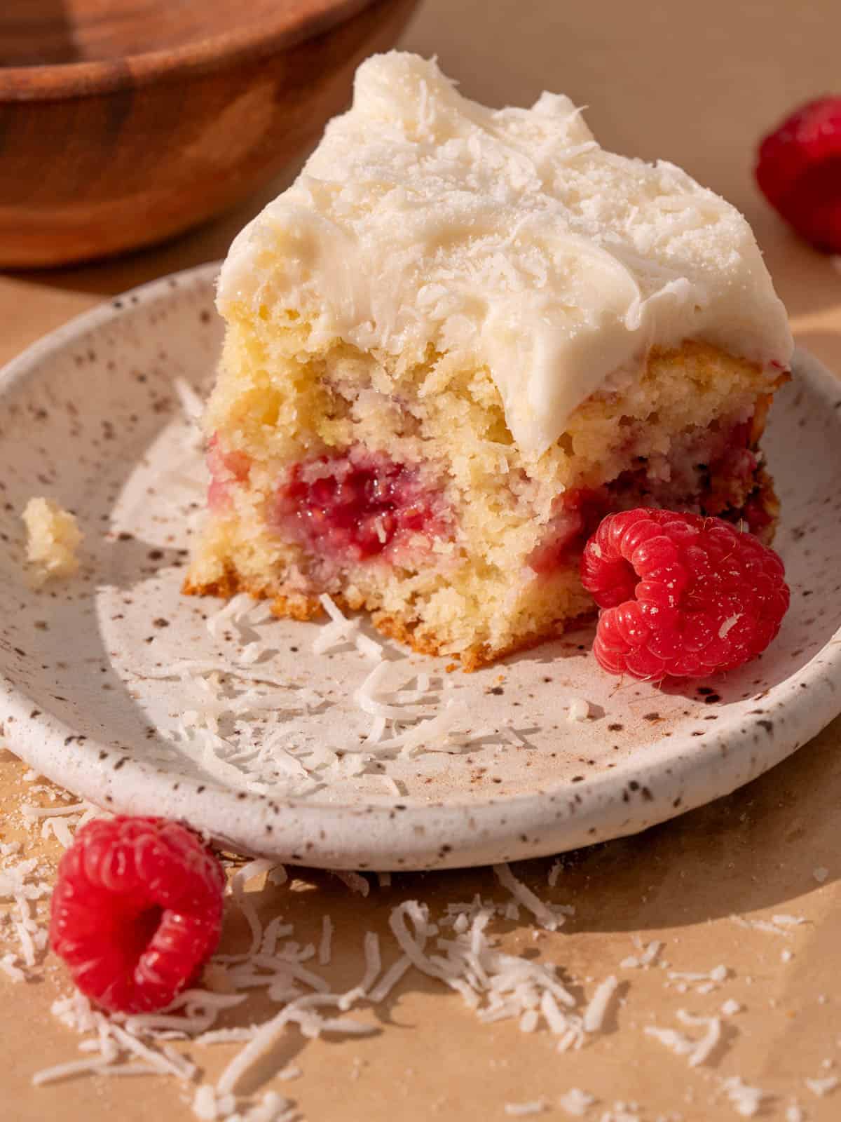 Showing the texture of the moist coconut cake on a plate.