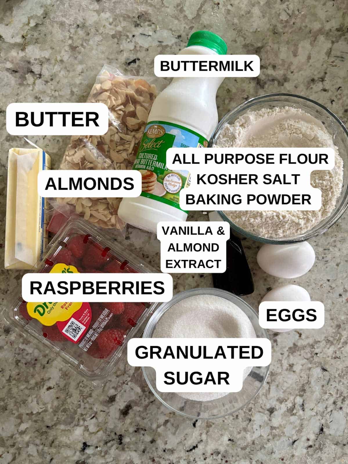 Ingredients on the counter labeled for the cake recipe.