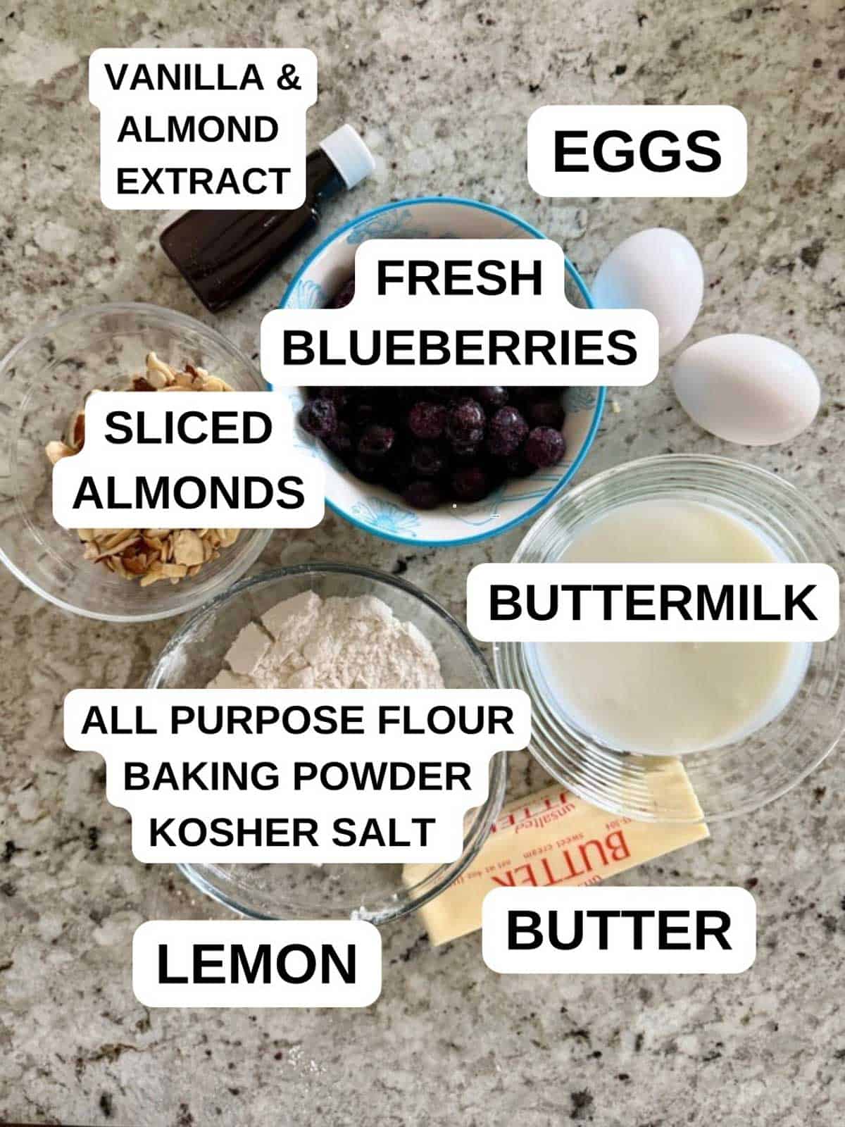 Ingredients labeled for the almond blueberry cake recipe on the counter.