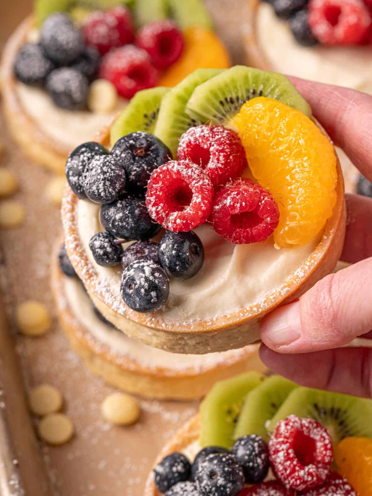 A close up of the fruit on top of the white chocolate ganache mousse.