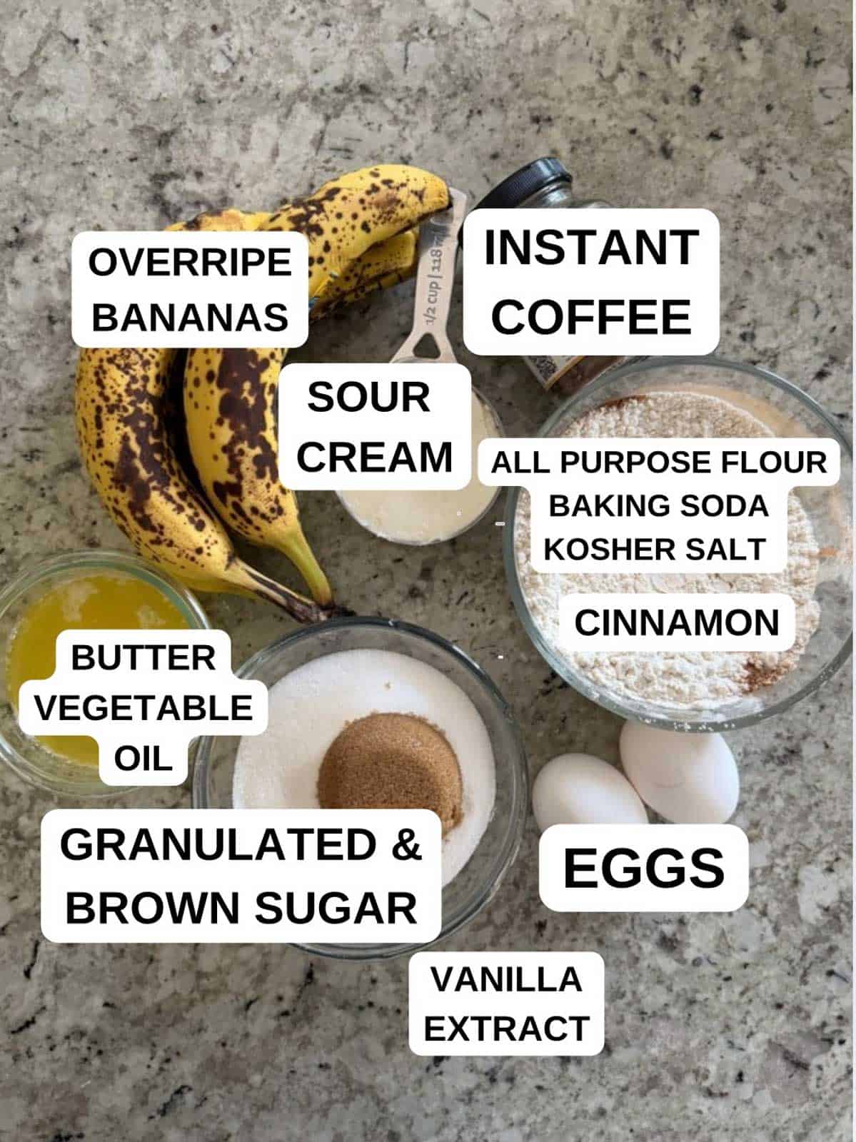 Ingredients for the banana bread recipe labeled on the counter.